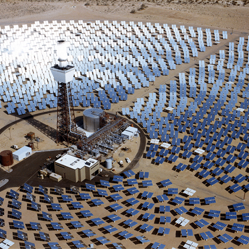 A field of solar panels forming a circle pattern.