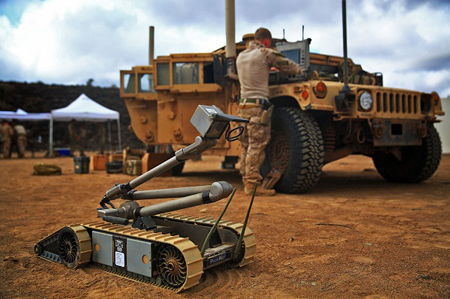 Autonomous Multifunctional Robot with a soldier by a Jeep in the background