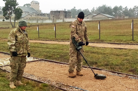 Two students practicing with ground penetrating radar for mine detection