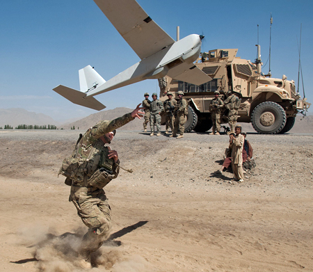 Soldier launching a PUMA Unmanned Aerial Vehicle