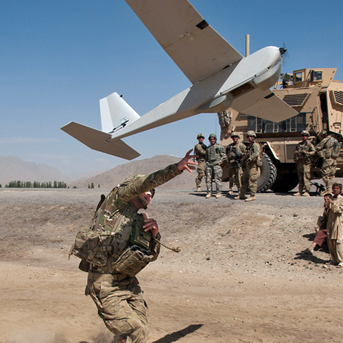 Soldier launching a drone for imaging with PUMA Unmanned Aerial Vehicle and DJI Matrice Hexacopter