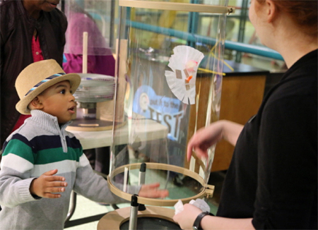 Young boy working on the Build and Test an Aerial Vehicle activity at Spark!Lab.