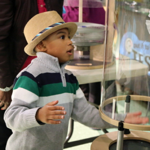 Young boy working on the "Build and Test an Aerial Vehicle" activity at Spark!Lab