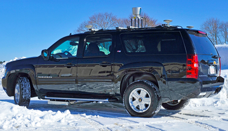 Side view of self-driving vehicle equipped with ground penetrating radar.