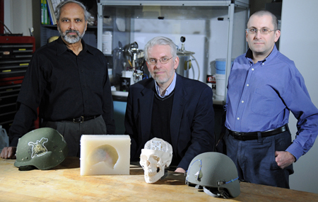 Three scientists posing with GelMan and Quad Guard Flak Jacket