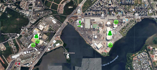 An overhead view of the northwest section of the Lagoa de Jacarepaguá area in Rio de Janeiro. Some buildings are marked with grey or green nuclear symbols and head-and-shoulders outlines of people, simulating the tracking of sensors. 