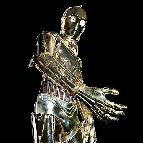 C-3PO costume, standing with arm outstretched