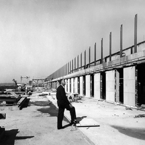 Founding director Frank Taylor stands on the Museum's 5th floor terrace, surveying construction.